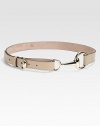 A stylish leather belt with light gold hardware and requisite horsebit buckle.About 1 wideMade in Italy 