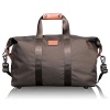 This is a classic soft satchel design in a smaller size--ideal for overnight or more relaxed travel. The roomy main compartment features a zip pocket and key hook. Made from Tumi's signature ballistic nylon, it has carry handles with a comfortable leather wrap and a removable, adjustable shoulder strap.