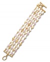 Five polished rows of shimmer. Lauren by Ralph Lauren's pretty bracelet features a trendy toggle clasp and rows of gold discs, freshwater pearls (4 mm) and light pink jade accents. Set in gold tone mixed metal. Approximate length: 7-1/2 inches.