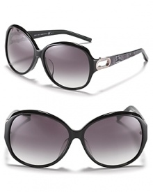 Turn heads in these oversized round sunglasses with open metal temples and reptile print along arms.