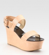 Adjustable slingback and ultra-high platform characterize this strappy leather wedge. Self-covered wedge, 3½ (90mm)Covered platform, 2 (50mm)Compares to a 1½ heel (40mm)Leather upperLeather liningRubber soleImportedOUR FIT MODEL RECOMMENDS ordering true size. 