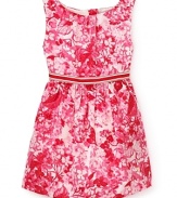 A sleeveless vision of delicate plum-colored flowers spring forth from this floral print dress by Juicy Couture.