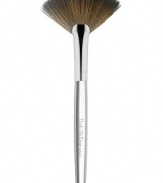 The latest addition to Trish's iconic collection of handcrafted makeup artistry brushes, the flat, arched shape and fine edge of Brush 62 Fan is precision-cut to deposit a whisper of color along the features, a veil of finishing powder to the under-eye, or as a tool to gently fan away fallout for a perfect finish. 