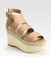 Adjustable, smooth leather straps accompanied by a wooden, espadrille-inspired wedge and platform. Wooden wedge, 3 (75mm)Wooden platform, 2 (50mm)Compares to a 1 heel (25mm)Leather upperLeather liningBuffed leather solePadded insoleImportedOUR FIT MODEL RECOMMENDS ordering true size. 