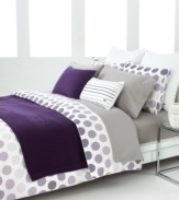 Spot on. Lined dots in shades of purple give this Lacoste comforter set a decidedly mod appeal. Self-reversing; finished with a solid piped edge.