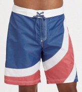 A summer favorite, for the beach and beyond, brightly designed in quick-drying nylon for maximum comfort and support.Drawstring tie waistBack flap pocketInseam, about 9NylonMachine washImported