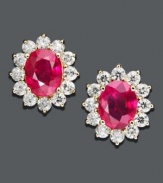 Add some sizzle with red-hot studs. Earrings feature a royalty-inspired design with oval-cut rubies (4-3/8 ct. t.w.) surrounded by sparkling round-cut IGI Certified diamonds (1-9/10 ct. t.w.). Crafted in 14k gold. Approximate diameter: 1/2 inch.