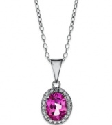 Pretty in pink. Victoria Townsend's polished pendant features an oval-cut pink topaz (1-1/8 ct. t.w.) surrounded by diamond accents. Set in sterling silver. Approximate length: 18 inches. Approximate drop: 3/4 inch.