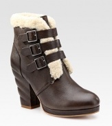 Soft leather look with a uniquely twisted heel, a trio of buckles and plush shearling trim. Self-covered heel, 4 (100mm) Covered platform, ½ (15mm) Compares to a 3½ heel (90mm) Leather and shearling upper Leather lining and sole Padded insole Imported