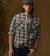 A border-print shirt uniquely uses an ornate floral pattern over a plaid motif for an intricate and individual look.