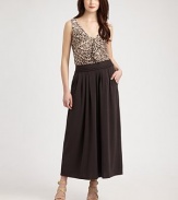 Offering a relaxed fit and just the right amount of stretch, this long skirt features a braided waist detail for bohemian appeal. Braided detail along waistbandSubtle pleatsSide zipperSlash pocketsAbout 38 long63% rayon/30% cotton/7% spandexDry cleanImported Model shown is 5'10 (177cm) wearing US size Small. 