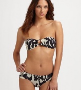 This retro-style bikini will make a splash, with center ring detail and ruched bottoms. Padded bandeau top with center ringBack tieRemovable strapsSide ruching on bottomsFully linedHand wash86% polyamide/14% elastaneHand washImported