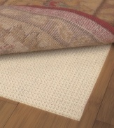 Extend the life of your rug with the Sure Grip Rug Pad. Designed to keep your rug in place, the rug pad prevents floor scratches and can be used on any hard surface. Consistent thickness throughout its construction makes for a smooth, wrinkle-free area rug that's easy to vacuum. Simply cut the pad with scissors to fit the exact shape and size of your rug!