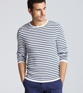 Narrow stripes add a nautical appeal to this lightweight sweater from Vince.