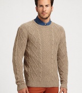 Made from cozy lamb's wool, a classic cable-knit sweater with a modern fit. CrewneckPulloverRibbed trimWoolDry cleanImported