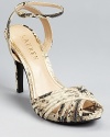 A strappy, snakeskin embossed silhouette from Lauren by Ralph Lauren lends itself to daytime and after-hours alike.