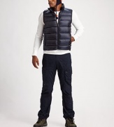 This smart puffer vest sports silvertone details and a lush down fill to protect you against all the elements.Mockneck collarSleevelessZip-front closureZippered side pocketsMesh interiorAbout 24½ from shoulder to hemNylonFill: 80% down/20% other feathersMachine washImported