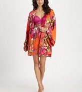 A bold floral print covers this draped design of silky-smooth fabric, creating a beautiful layering piece. Long kimono sleevesSelf-tie waist with belt loopsAbout 35 from shoulder to hemPolyesterMachine washImported