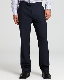 Straight leg, flat front tailored dress pants. Trouser-style front pockets with two back buttoned besom pockets. Covered tab waistband.