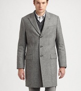 Tailored in virgin wool, this tweed overcoat is the ultimate winter wardrobe option for the dapper, gentleman of style.Button-frontChest welt, hip flap pocketsAbout 37 from shoulder to hemVirgin woolDry cleanMade in Italy