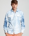 Bold bleach marks single out this cool denim sport shirt for excellence.