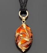 Intricately crafted in Murano glass, this beautiful pendant inspires thought and awe. Pendant hangs from a smooth black cord.  Approximate drop: 1-3/4 inches. Approximate length: 34 inches.