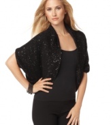 Top your look off with a chic, sparkling cozy from Calvin Klein!