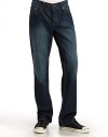 Slightly fitted, yet exceptionally comfortable, this slim-fit cotton denim classic comes in the season's trendiest hue.Mid-width waistband with belt loops Front zipper and button fly Five-pocket style Contrast stitching and logo patch at backpocket Inseam, about 34 Cotton; hand wash or machine wash Imported