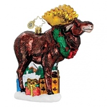 A merry moose with gold antlers standing among holiday presents wears a Christmas wreath.