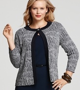 Infuse your look with uptown polish in this Jones New York Collection cardigan, crafted in a textured bouclé knit with solid ribbed trim. Complete the refined look with a chic pencil skirt and a string of pearls.