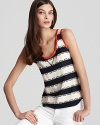 Fanciful half moons add a whimsical twist to the classic nautical stripe. Pair the Tory Burch tank with white denim to anchor in the trend.