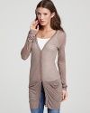 This light-as-a-feather ALTERNATIVE cardigan, featuring front pockets for a casual edge, is an all-season must-have.