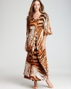 An abstract mix of tiger stripes and leopard spots covers this Natori robe, featuring ruffle trim at the waist.