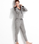 Warm and snuggly from head to toe. Kensie's hooded jumpsuit features contrasting cuffs and placket with a snap closure.