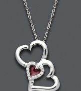 Say it from the heart. Treasured Hearts' stunning pendant features three, open-cut hearts in sterling silver. Center heart features a red enamel center surrounded by sparkling, round-cut diamonds (1/10 ct. t.w.). Approximate length: 18 inches. Approximate drop: 1 inch.