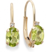 Sparkling perfection. Add a vibrant pop of color to your look with oval-cut peridots (3/4 ct. t.w.) and sparkling diamond accents. Crafted in a 14k gold leverback setting. Approximate drop: 3/4 inch.