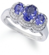 A true beauty. This stunning ring features three oval-cut tanzanite stones (1-1/4 ct. t.w.) surrounded by halos of round-cut diamond accents. Set in sterling silver. Size 7.