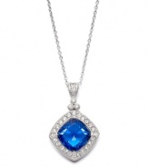 Evening-ready and perfect for an elegant affair, Eliot Danori's stunning pendant highlights a diamond-cut blue glass center highlighted by a halo of sparkling clear crystals. Crafted in silver tone mixed metal. Approximate length: 16 inches + 2-inch extender. Approximate drop: 1 inch.