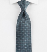 A savvy, sophisticated look woven in Italian silk, with a geometric pattern detail.SilkDry cleanMade in Italy