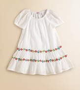 Tailored in airy cotton, this angelic frock is beautifully complemented with ruffled hem and two tiers of colorful, embroidered flowers.Elastic scoopneckShort puffed sleevesPullover styleRuffled hemCottonMachine washImported