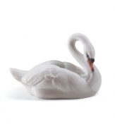 The epitome of elegance, the Lladro swan figurine captures all the serenity and grace of nature's ugly duckling in glazed porcelain.