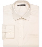 A classic Michael Kors non-iron dress shirt featuring a spread collar, barrel cuffs and a left chest pocket.