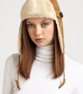 This essential trapper hat is crafted in plush suede with shearling fur trim for extra-stylish warmth.Dyed shearling trim/SuedeSuede chin tiesCircumference, 22.75Dry cleanFur origin: SpainImported