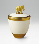 Exotic design in fine porcelain holds a scented candle inside and is topped with a gold-painted elephant. Handpainted 14k gold trim Pink Champagne scented candle Crafted with Limoges porcelain paste Beautifully gift boxed About 5H Made in Portugal