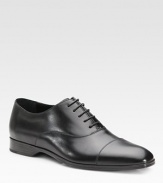 An elegant dress standard features a cap toe and beveled outsole with signature initial detail. Leather lining Padded insole Rubber sole Made in Italy 