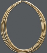 Strands of spun gold. This unique necklace highlights eight strands of gold tone silicone with a 14k gold clasp. Approximate length: 18 inches.