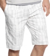 Subdued tones elevate these plaid shorts from Calvin Klein. The perfect pair for a more refined summer look.