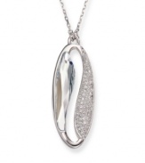 Make a statement of harmony and purity. Swarovski's silver tone mixed metal pendant is inspired by the Yin and Yang. The lightness of the large faceted azure Swarovski crystal contrasts with the clear crystals in a pavé setting, providing a harmonious mix of glitter and gleam. Approximate length: 19 inches. Approximate drop: 1-1/4 inches.