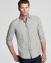 Faded denim lends authenticity to your casual cool look. This shirt is a definite weekend staple.