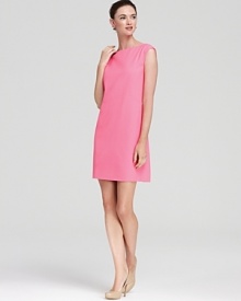 A searing neon shade glows atop a sleek kate spade new york shift dress for impact style. Keep the look strong with sleek accessories.